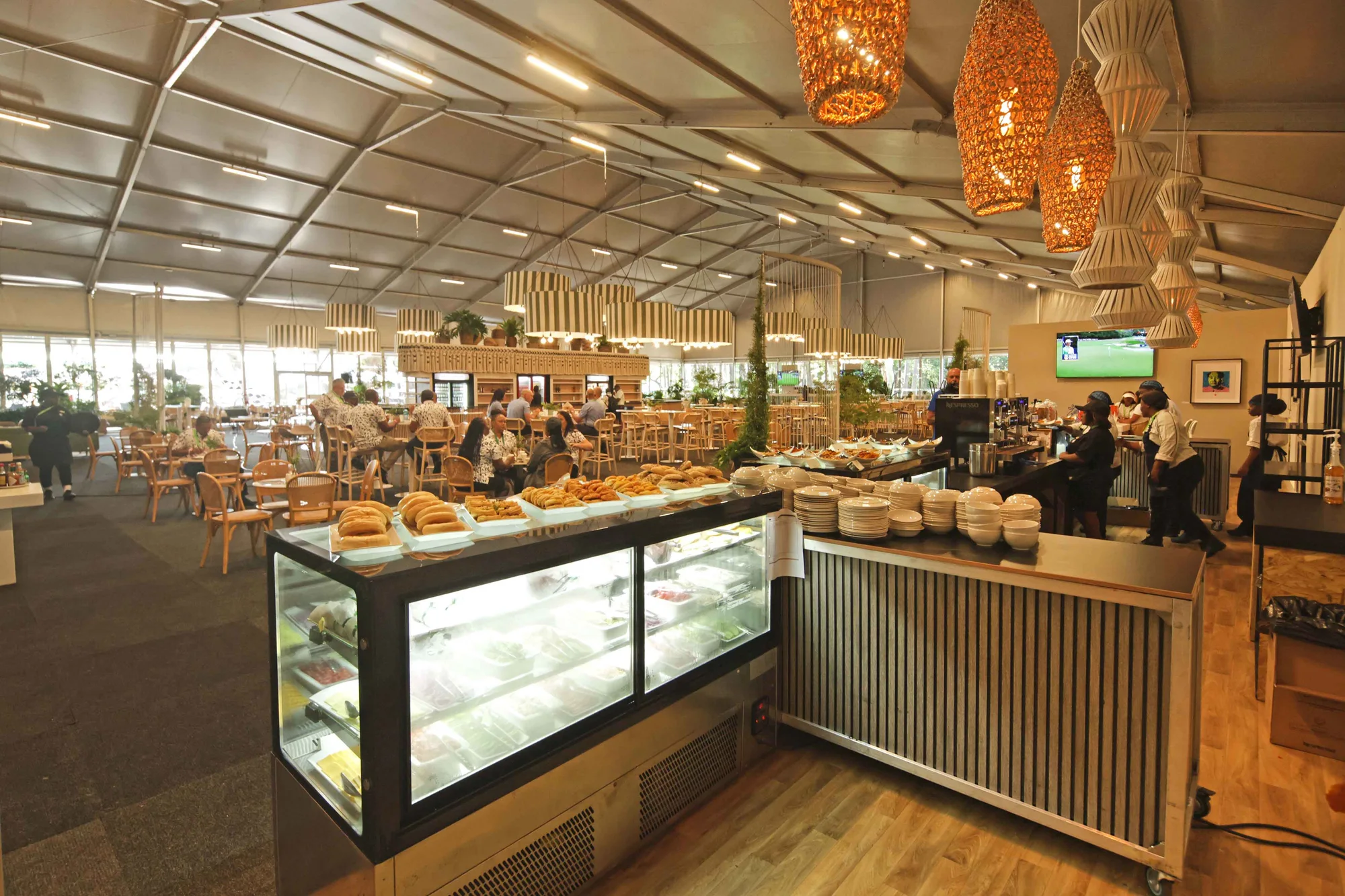 Catering counters inside a Nedbank Golf Challenge hospitality pavilion