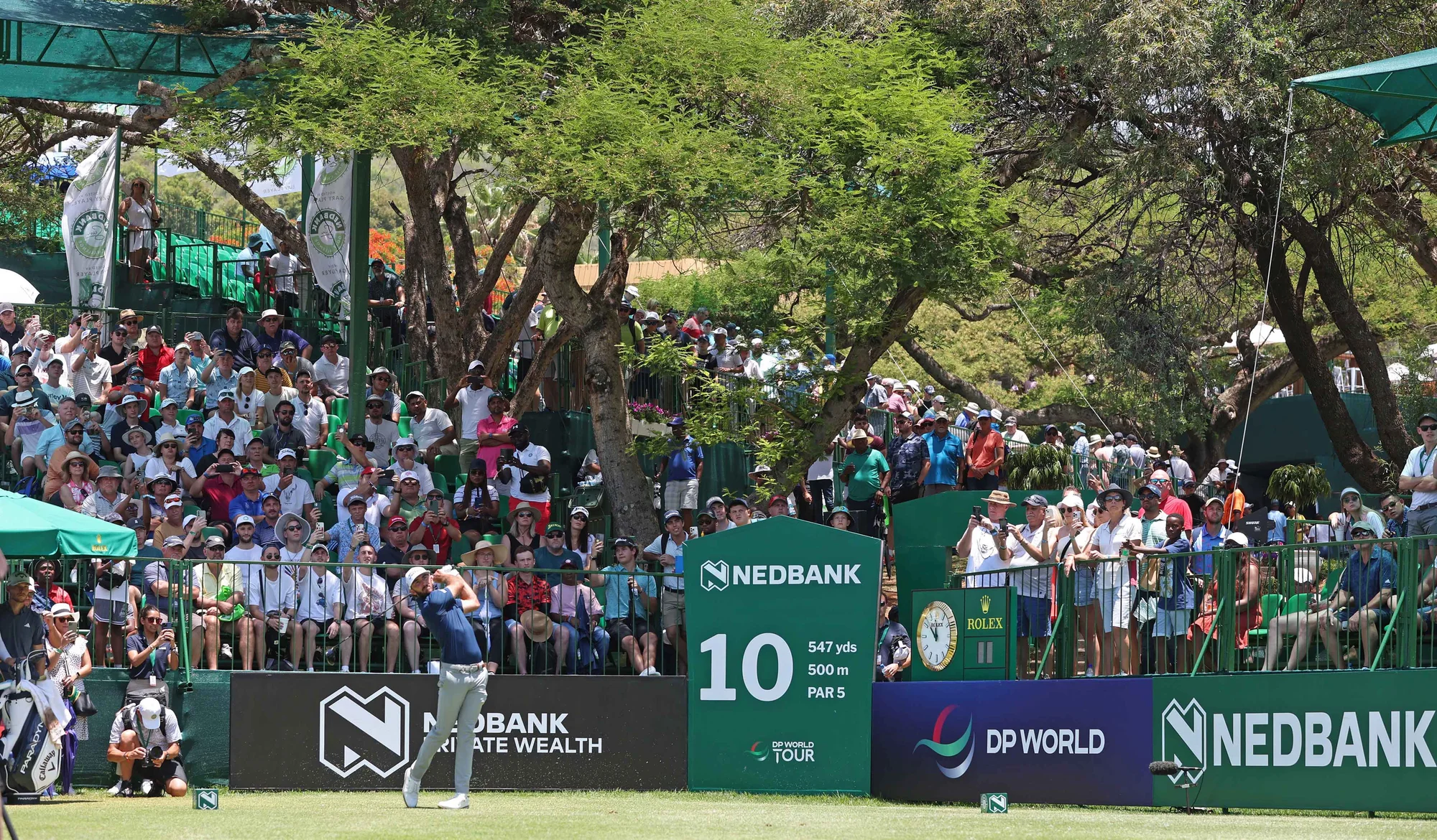 Spectators gathered beside the tenth hole at the Nedbank Golf Challenge
